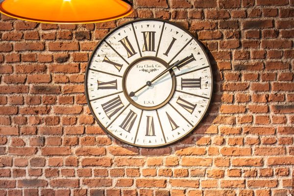 Heritage Faux Brick Wall Panel Traditional M263 Red faux brick wall panels with a large industrial clock on the wall.